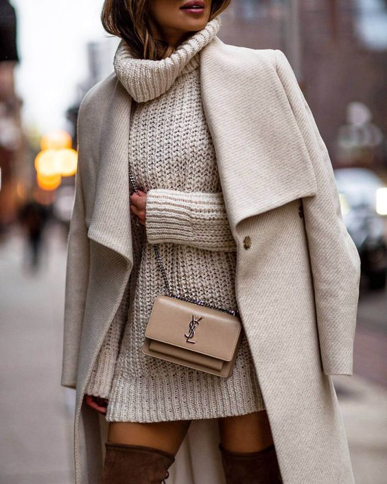 woman wearing oatmeal white long coat and tall brown suede boots