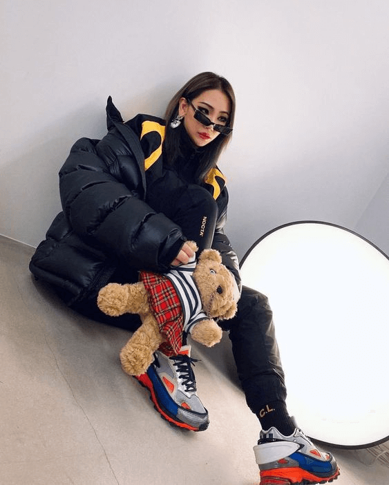 CL wearing a black puffy quilted jacket